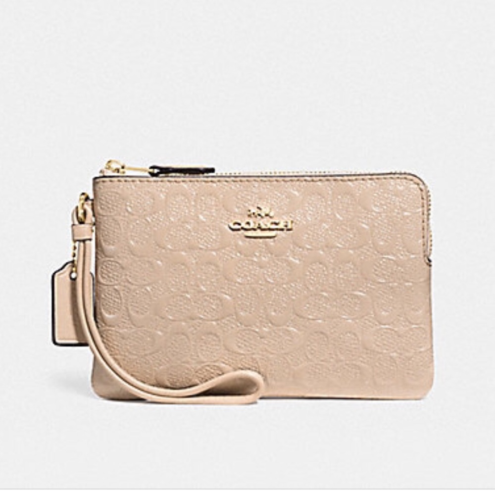 Coach corner zip  wristlet in signature  patent